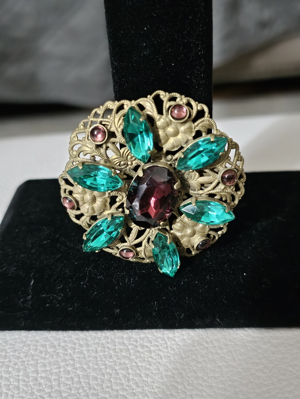 Vintage Antique-Style Green Crystal Floral Brooch with Burgundy Center